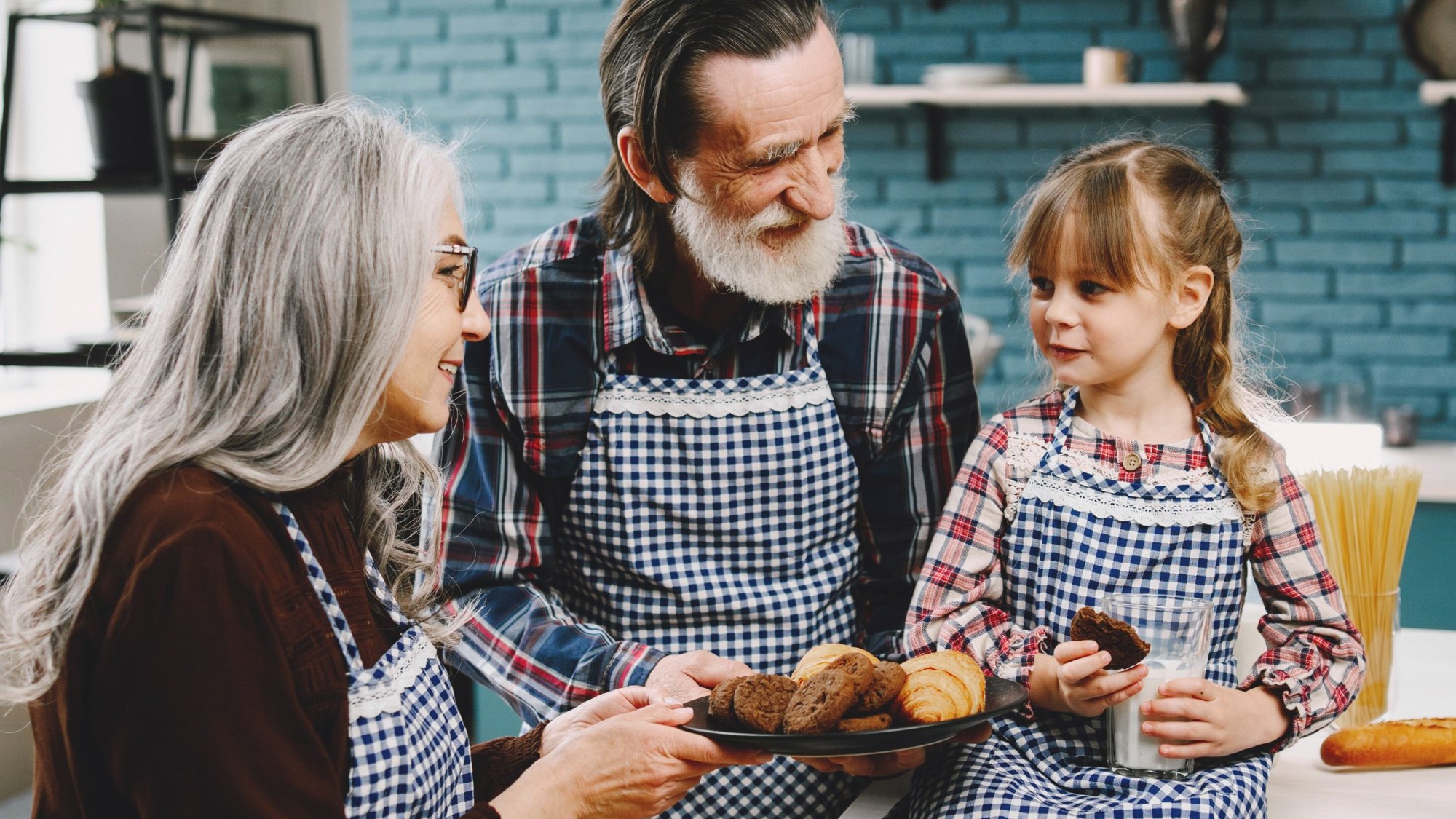 Grandparents baking with their granddaughter