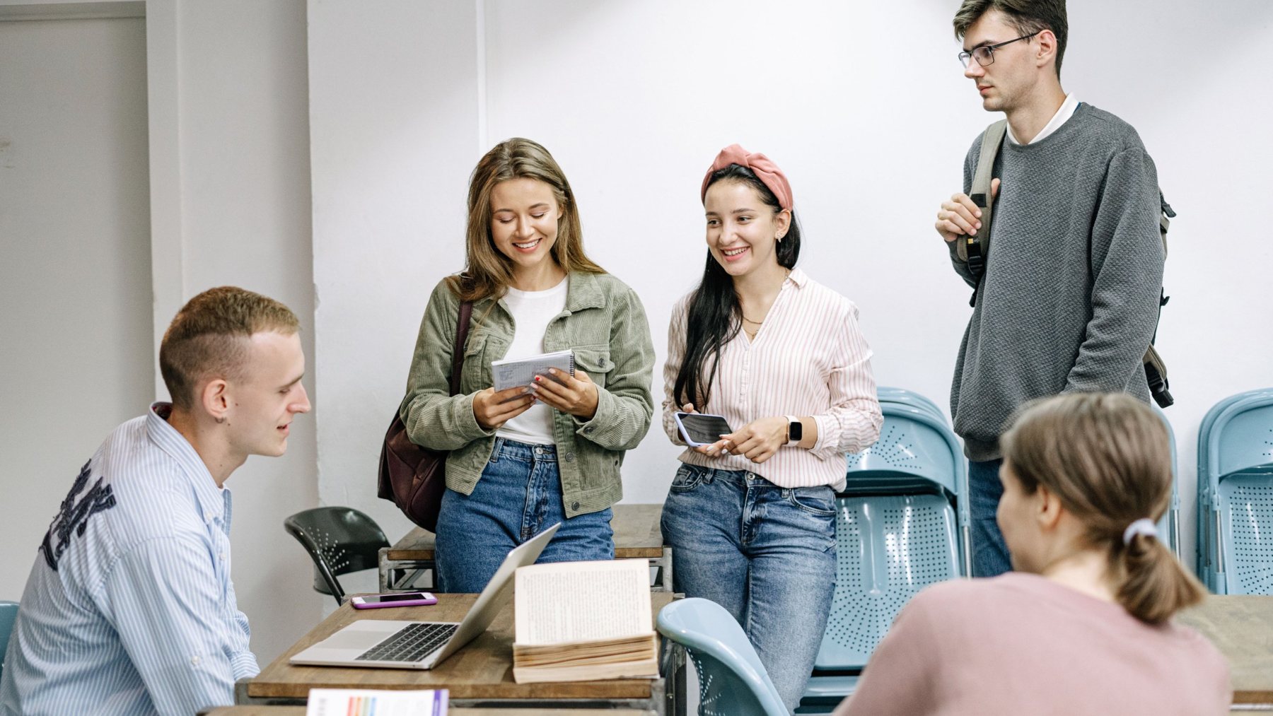 Students talking in a classroom before placement